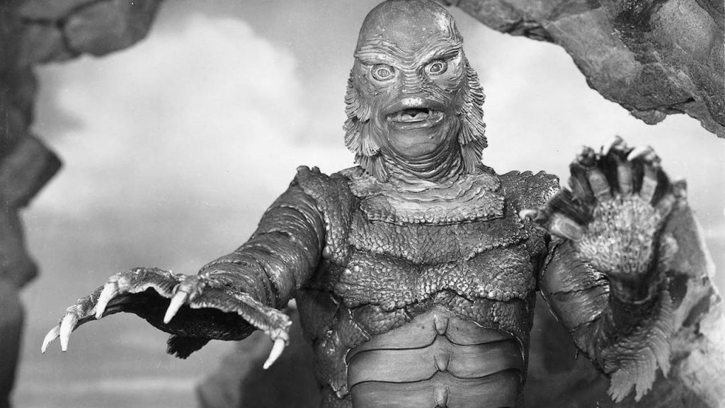 This is a still from CREATURE FROM THE BLACK LAGOON dir Jack Arnold (1954) showing the Gill-Man amphibious monster reaching out towards the viewer.