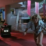 This is a film still from CHOPPING MALL dir Jim Wynorski (1986), showing at Beer Merchants Tap as part of CELLULOID JAM (Sun 16 March 2025).