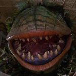 This is a still from LITTLE SHOP OF HORRORS showing a monstrous singing plant, its mouth wide open revealing deadly rows of fangs and a hungry maw. Showing as part of the All-Nighter Part IV: QUEER MONSTROSITY at Picturehouse Central (07 June 2025).